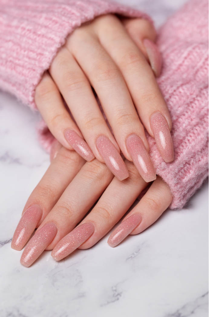 vecteezy_female hands with pink nail design_36313709
